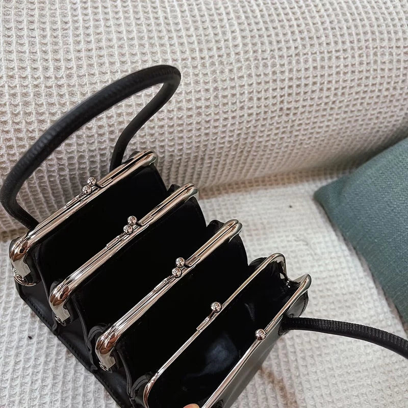Architectural Elegance Black Leather Handbag