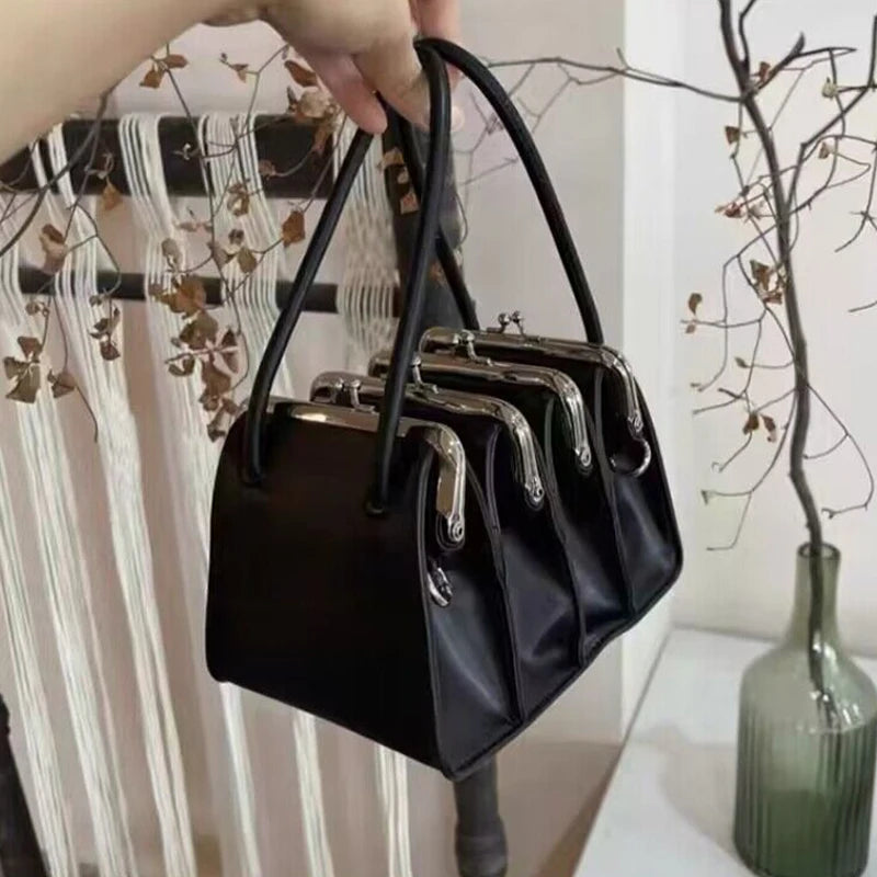 Architectural Elegance Black Leather Handbag