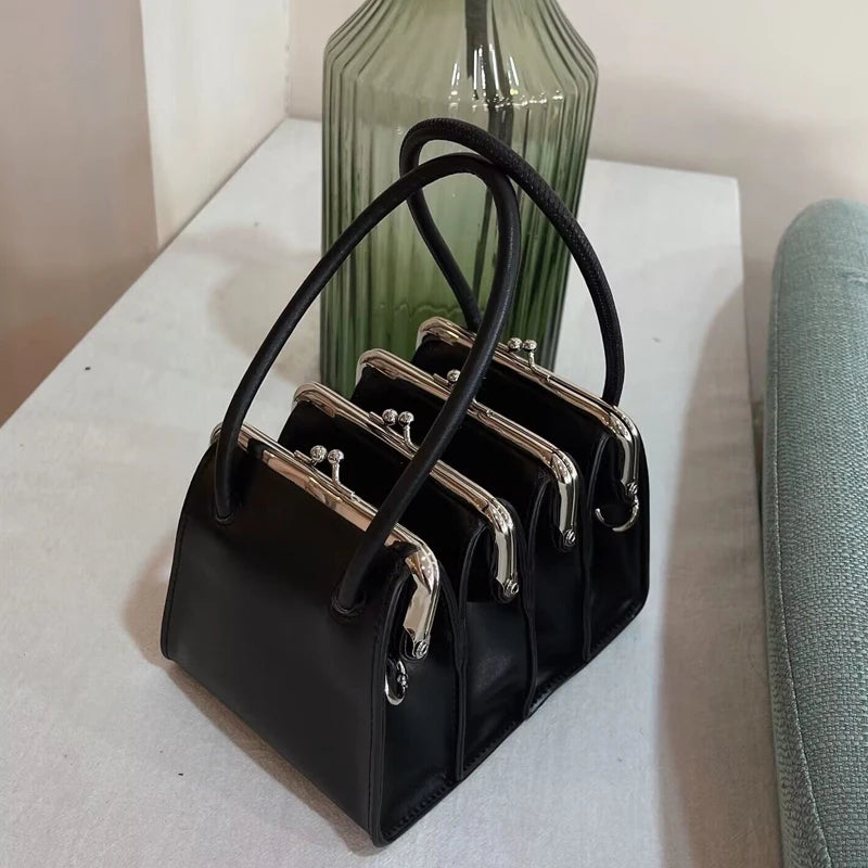 Architectural Elegance Black Leather Handbag