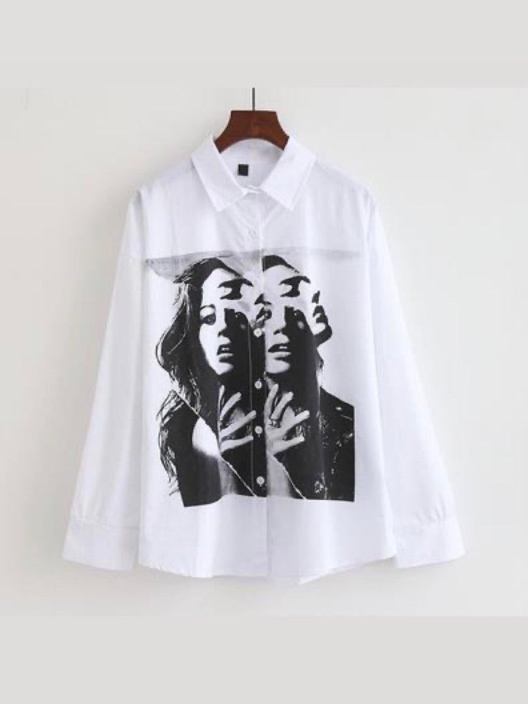 white shirt with a big picture printed in black and white split by the buttons that close the shirt of a woman from the front and a man in profile behind her