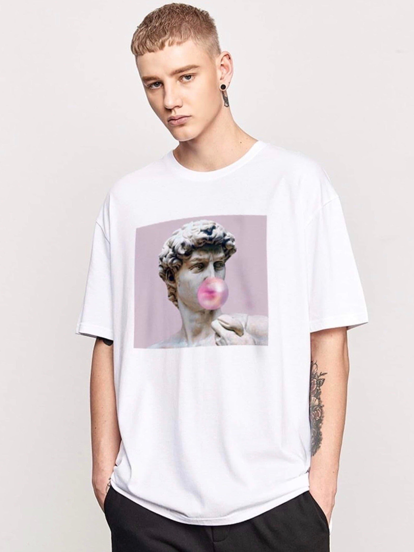 white tshirt with a picture of David, the sculpture of Michelangelo, making a pink bubble gum