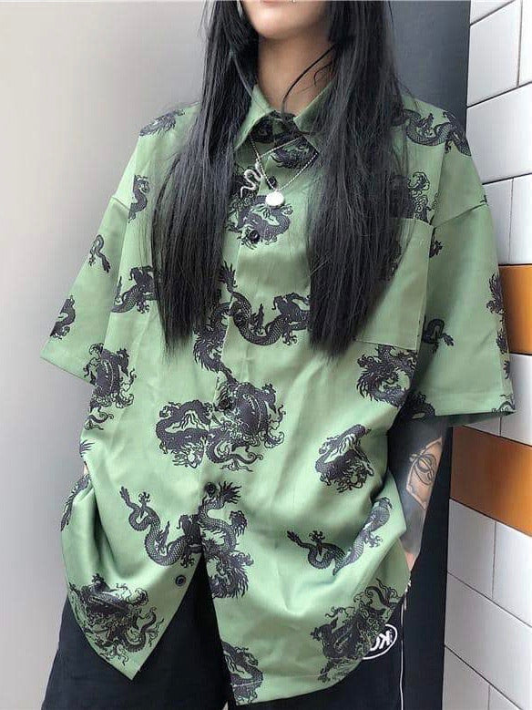 green shirt with black traditional patterns of dragon worn