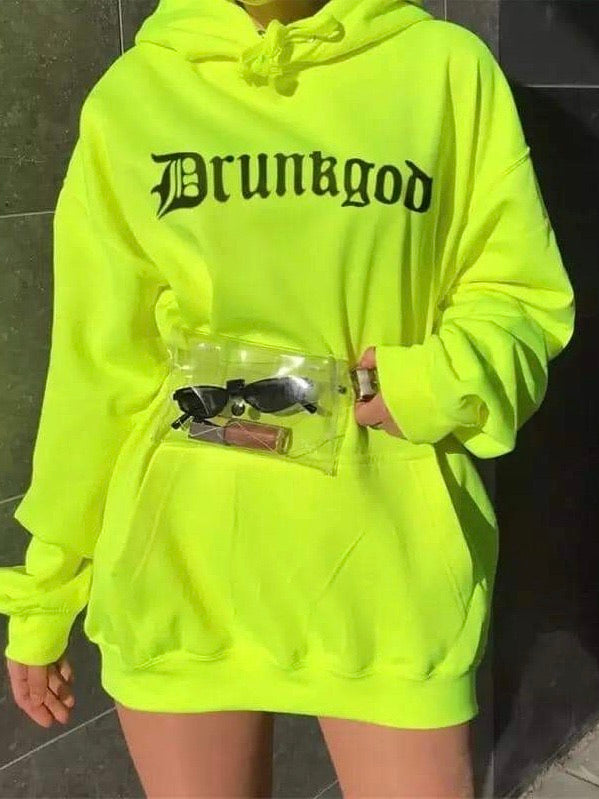 neon green hoodie with gothic letters which form the word drunkgod worn