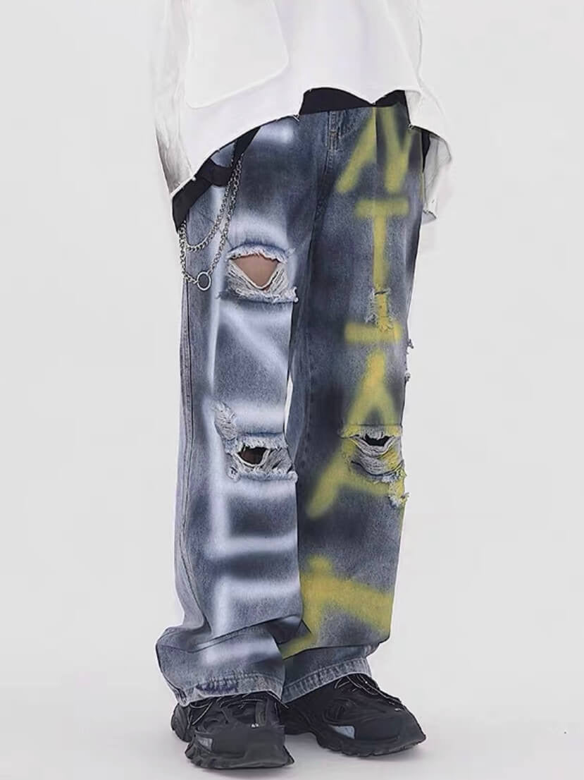 destroyed jeans with graffiti on legs blue