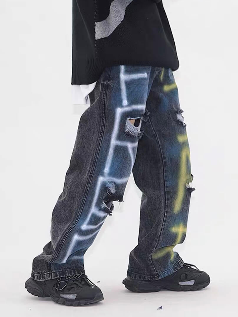 side view destroyed jeans with graffiti on legs, dark blue