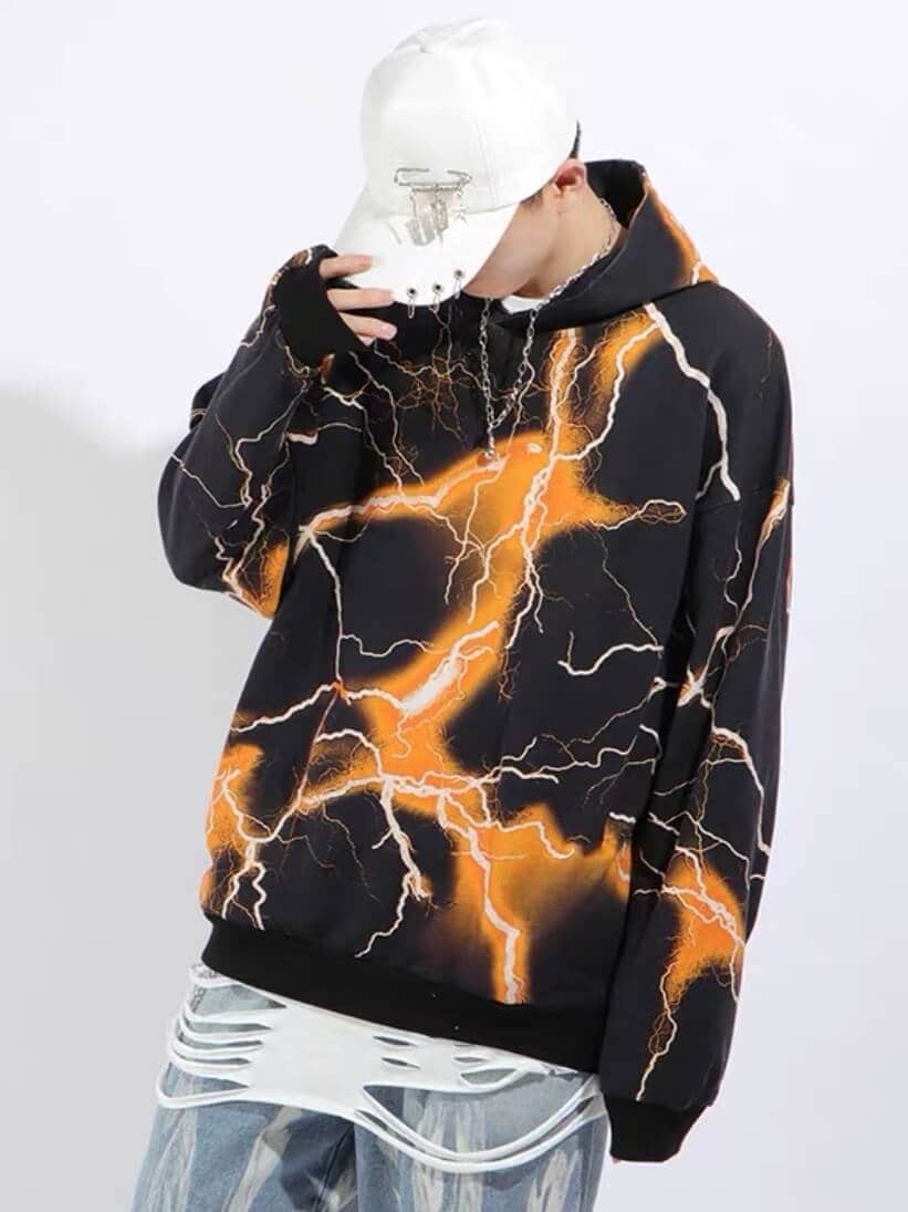 black hoodie with white flashes surrounded by an orange halo