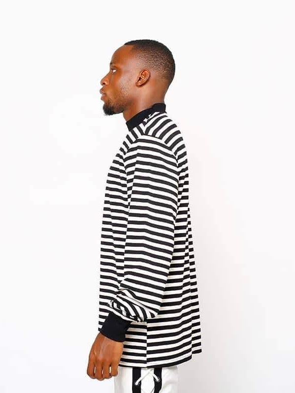 profile side of our black and white striped sweater with black wrists and collar