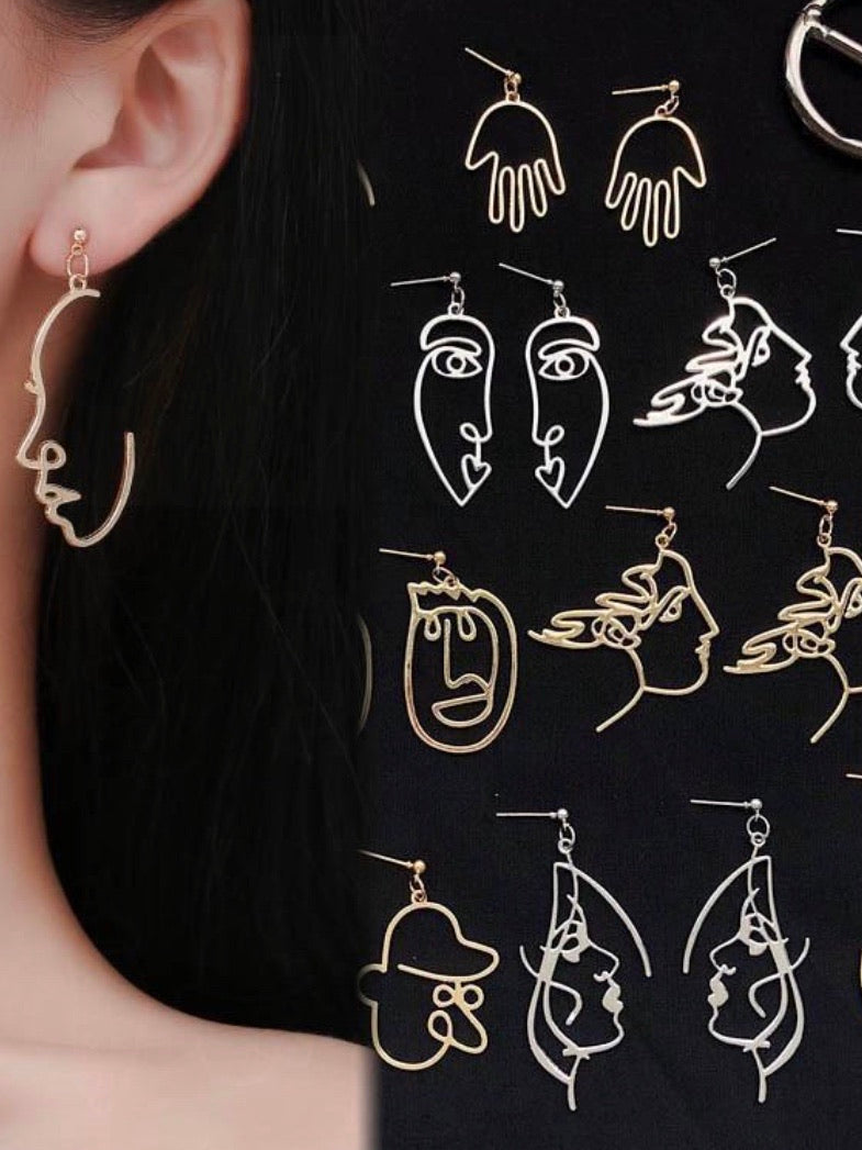 all of our retro face art earrings in gold and silver